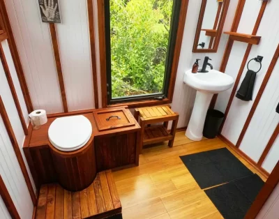 Bathroom area inside the tiny eco-friendly vacation rental at Da Fire Farm in Volcano, Hawaii