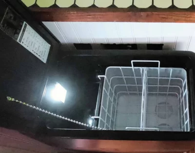 Inside view of the refrigerator in the tiny eco-friendly vacation rental at Da Fire Farm in Volcano, Hawaii