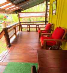Dining table and Deck chairs at the tiny eco-friendly vacation rental at Da Fire Farm in Volcano, Hawaii