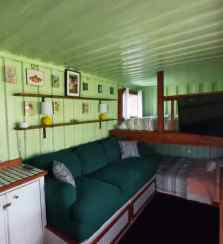 Counter, Beds, TV, couch area inside the tiny eco-friendly vacation rental at Da Fire Farm in Volcano, Hawaii