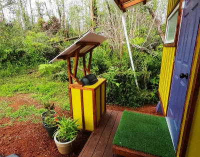 Trash area outside the tiny eco-friendly vacation rental at Da Fire Farm in Volcano, Hawaii