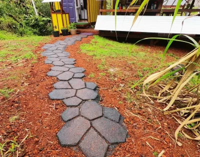 Close-up view of the walkway leading to the eco-friendly vacation rental at Da Fire Farm in Volcano, Hawaii
