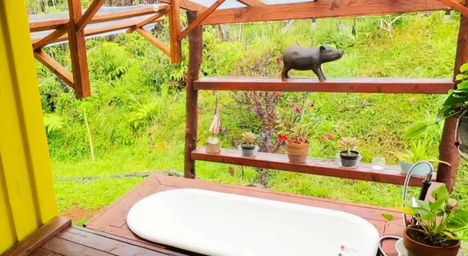 Outdoor bath area at the eco-friendly vacation rental, Da Fire Farm, in Volcano, Hawaii